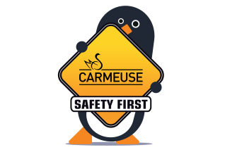 Pinguin holding a Yellow Sign saying Carmeuse & Safety First