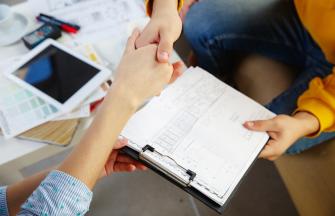 interior-designer-working-with-young-couple