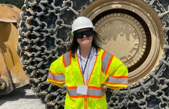 Girl in front of tire