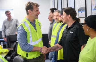 Congressman Mrvan shaking Carmeuse Worker's hand