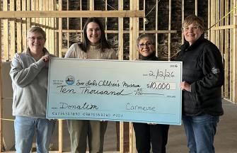 Cedarville and Drummond Island donation to Soo Locks Children's Museum