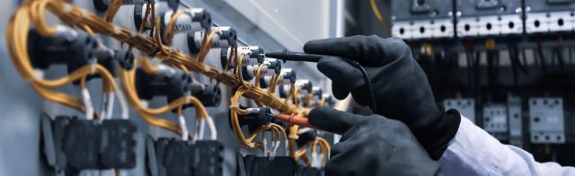 Electrician working with gloves