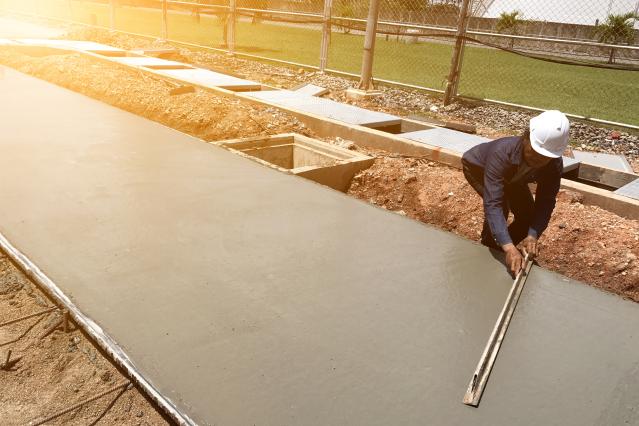 Leveling concrete with trowels