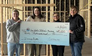 Cedarville and Drummond Island donation to Soo Locks Children's Museum