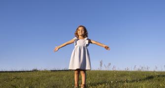 full-shot-smiley-girl-outside